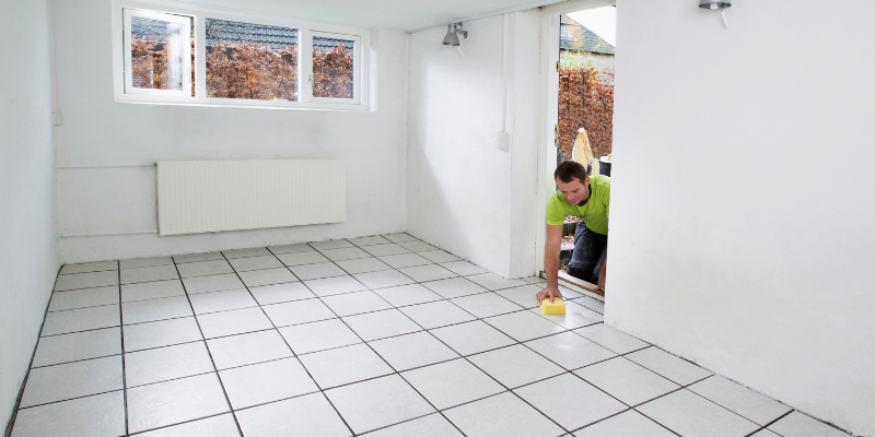 Man washes tile flooring
